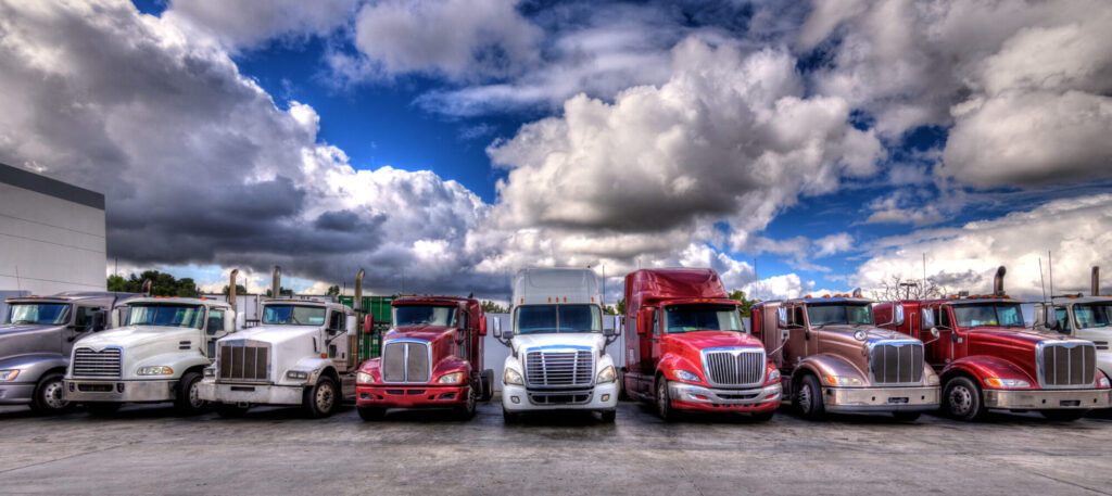 A row of colorful trucks parked in a line