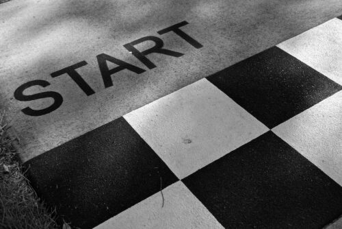 Start text on the ground with white and black checkered markings