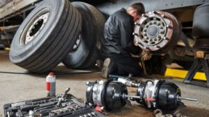 Trailer technician repairing a commercial vehicle.