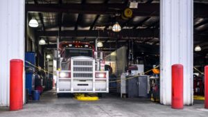 Commercial truck in a shop for repairs.